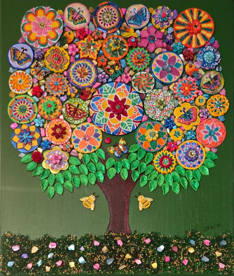 Dexi Miguel hand-painting individual clay medallions for Tree of Life
