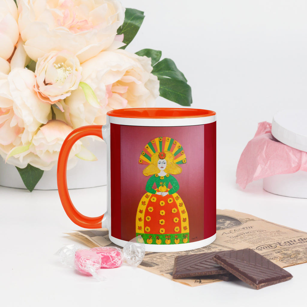 Autumn Pumpkin Princess ceramic mug by Dexi M. with orange handle and interior, showing colorful princess artwork.